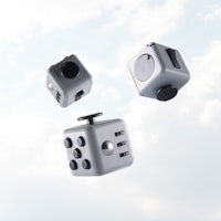 three silver cubes flying in the sky